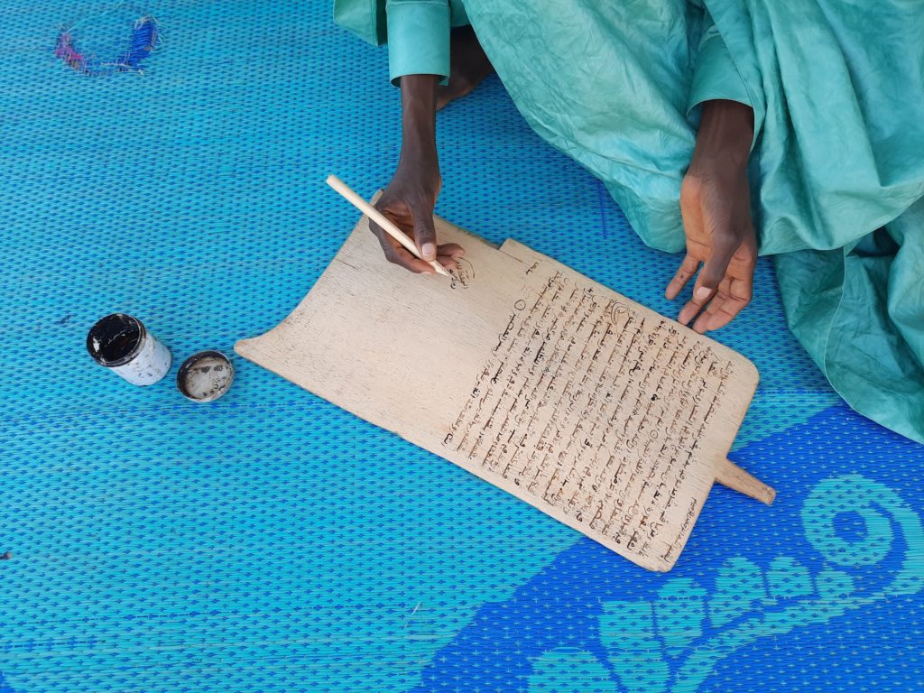 The alkalami (pen) and allo (wooden slate) are often the almajiri’s only writing tools.