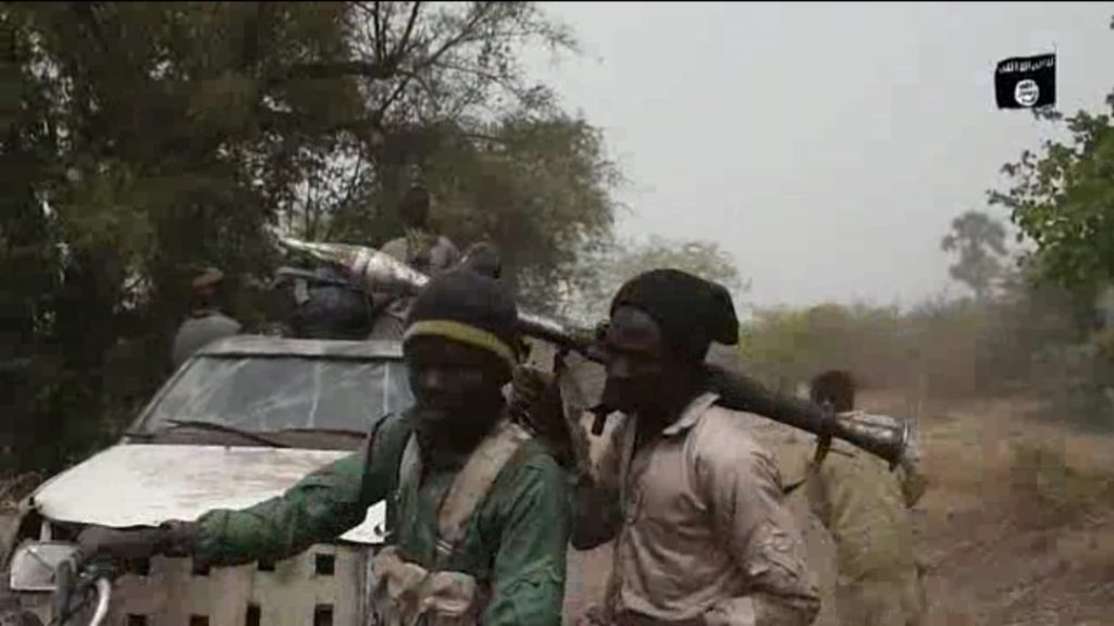 Fighter with an RPG-backed Boko Haram gun truck.